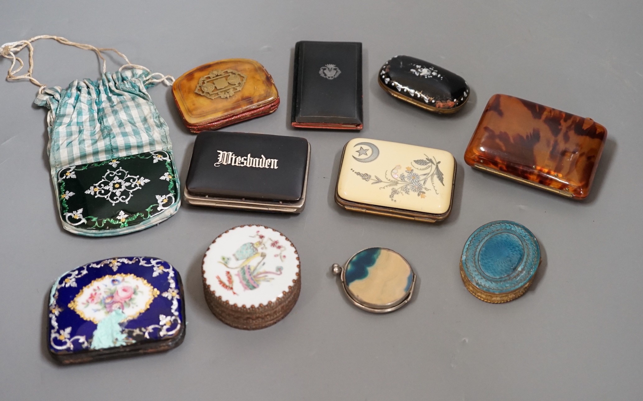 A mixed collection of enamel, tortoiseshell and other purses, a Chinese porcelain box and enamel topped box